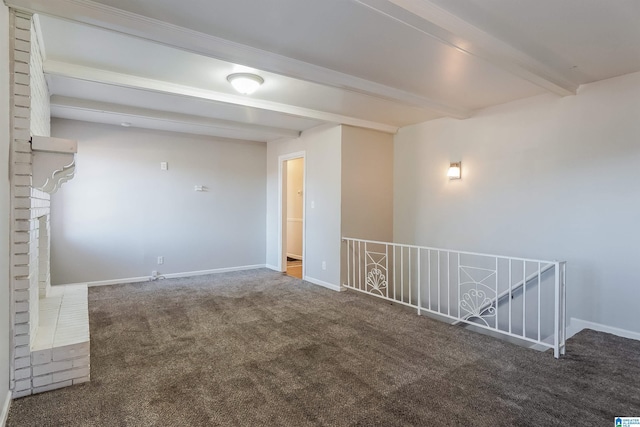 carpeted spare room featuring beam ceiling