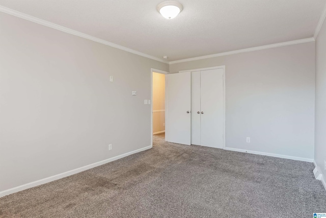 empty room with carpet flooring and ornamental molding