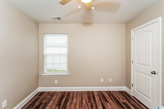 unfurnished room with dark hardwood / wood-style flooring and ceiling fan