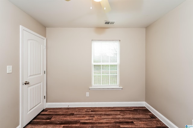 empty room featuring dark hardwood / wood-style floors and ceiling fan