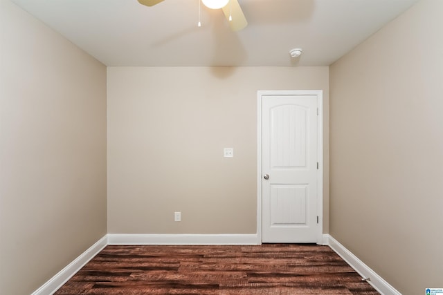 unfurnished room featuring dark hardwood / wood-style floors and ceiling fan