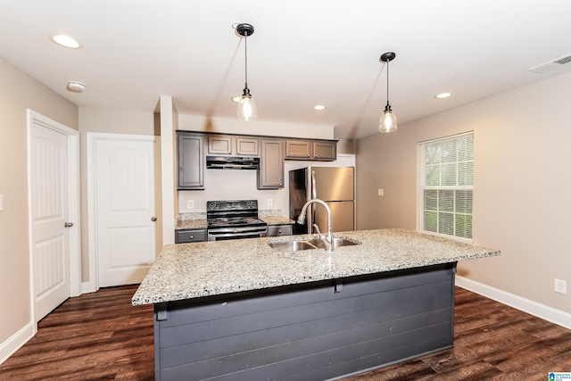 kitchen featuring stainless steel fridge, decorative light fixtures, black electric range oven, and sink