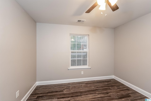 unfurnished room with ceiling fan and dark hardwood / wood-style flooring