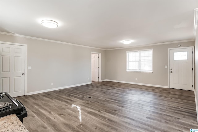 foyer entrance with dark hardwood / wood-style floors and crown molding