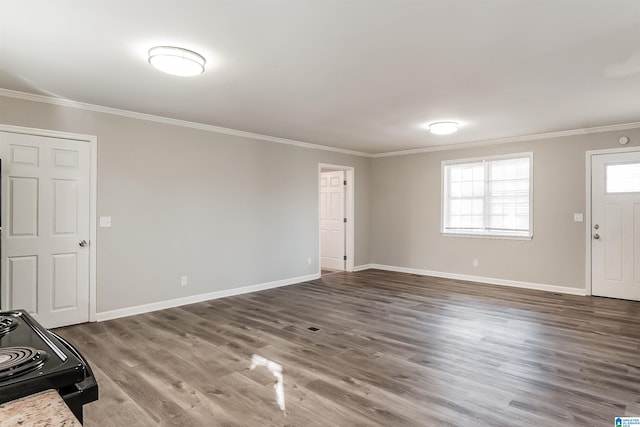 foyer with dark wood-type flooring and crown molding