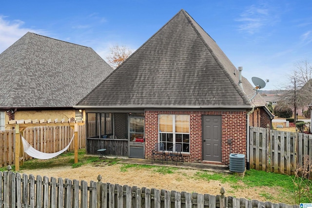 back of house featuring central AC unit