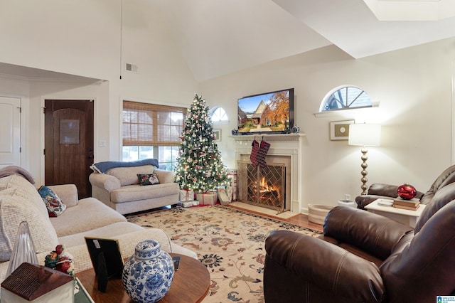 living room featuring hardwood / wood-style floors and high vaulted ceiling