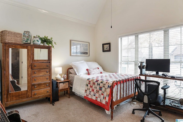 bedroom featuring carpet flooring, ornamental molding, and high vaulted ceiling