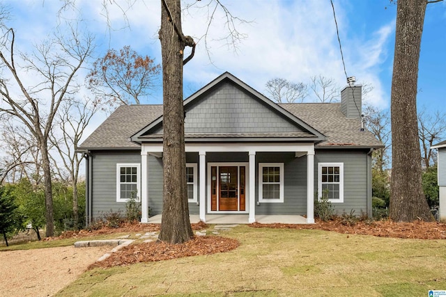 view of front facade with a porch and a front yard