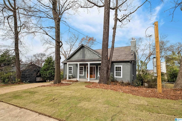 view of front of house featuring a porch and a front yard