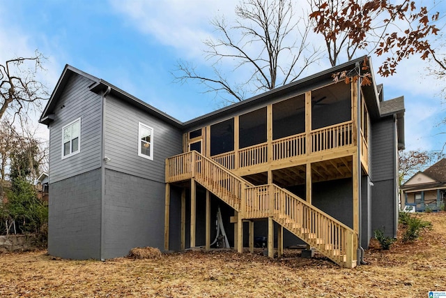 rear view of property with a sunroom