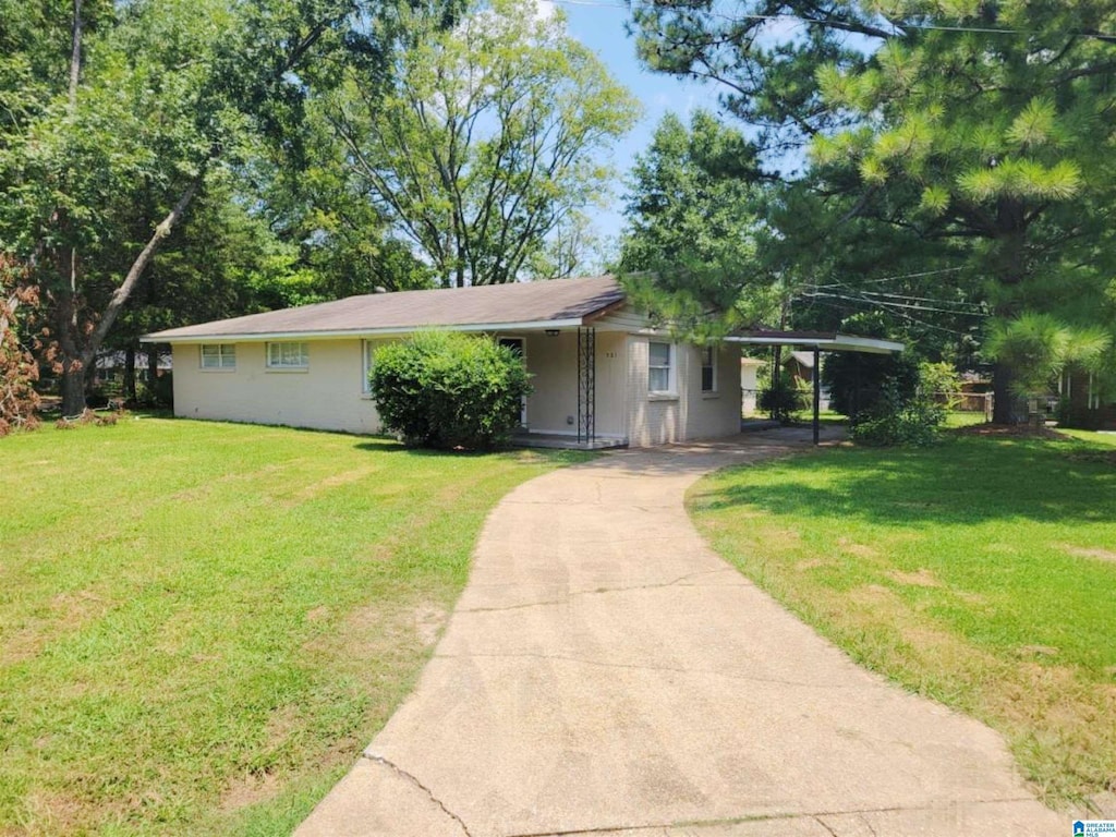 single story home featuring a front yard and a carport