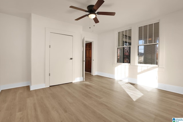 unfurnished room with light hardwood / wood-style floors and ceiling fan