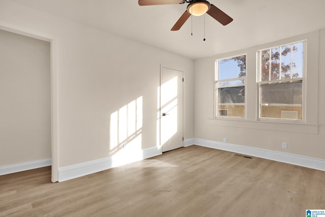 unfurnished room with light hardwood / wood-style flooring and ceiling fan