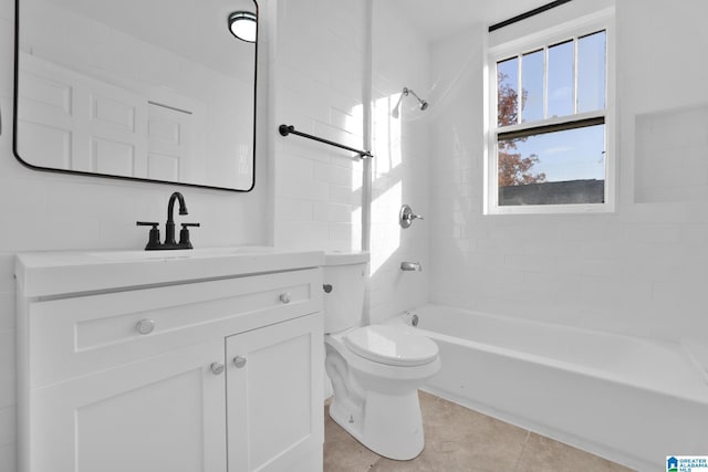 full bathroom with tile patterned flooring, vanity, toilet, and tiled shower / bath