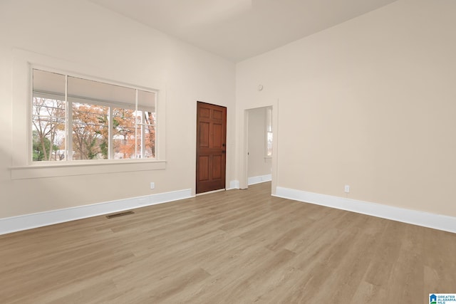 spare room featuring light wood-type flooring