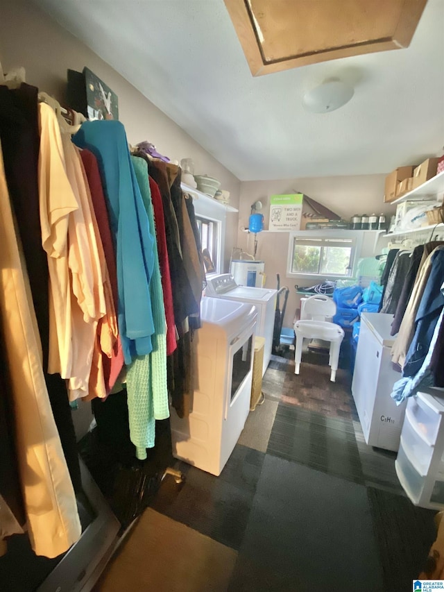 laundry room featuring washer and dryer and a healthy amount of sunlight