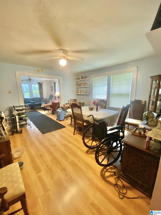 dining area featuring ceiling fan and hardwood / wood-style flooring