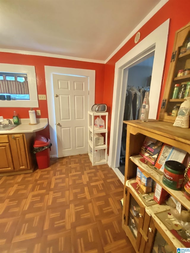 interior space with parquet floors and sink