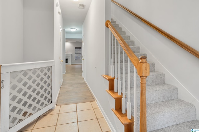 staircase with tile patterned floors