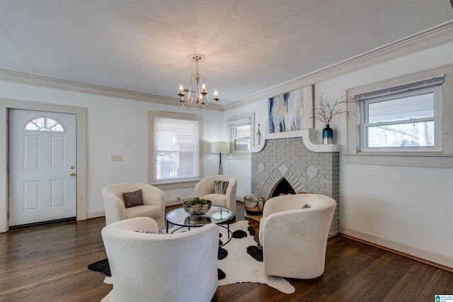 sitting room featuring dark hardwood / wood-style floors, a healthy amount of sunlight, ornamental molding, and a fireplace