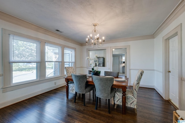 dining area featuring ornamental molding, an inviting chandelier, and dark wood-type flooring