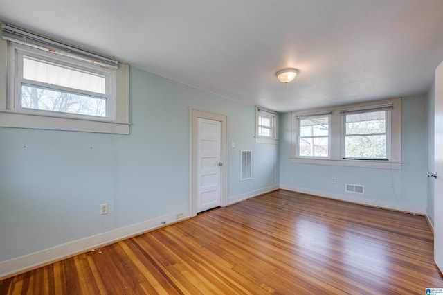 empty room featuring hardwood / wood-style floors