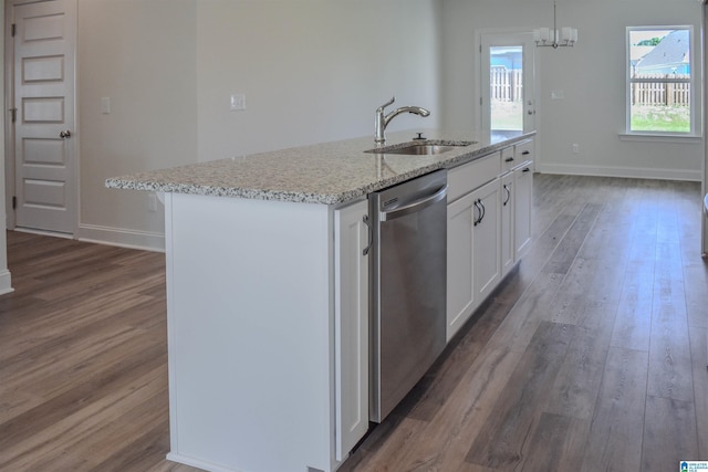 kitchen with sink, stainless steel dishwasher, pendant lighting, a kitchen island with sink, and white cabinets