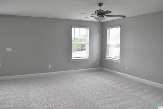 carpeted empty room with ceiling fan