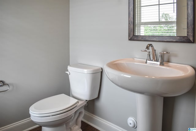 bathroom featuring sink and toilet