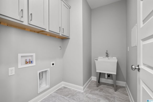 clothes washing area featuring washer hookup, electric dryer hookup, and cabinets