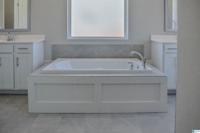 bathroom featuring a tub and vanity