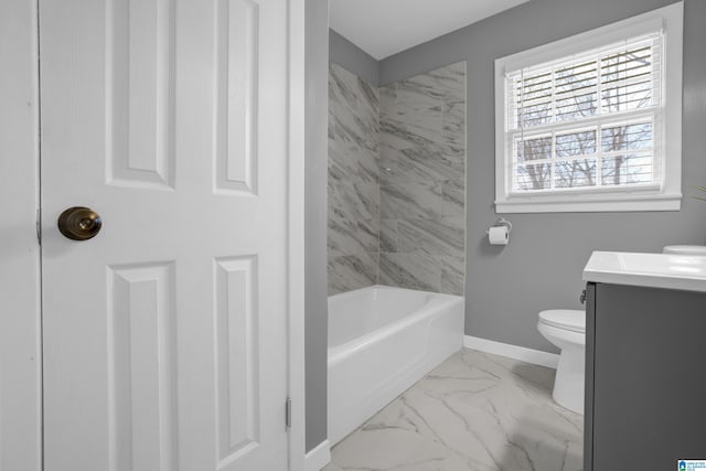 bathroom with marble finish floor, toilet, vanity, and baseboards