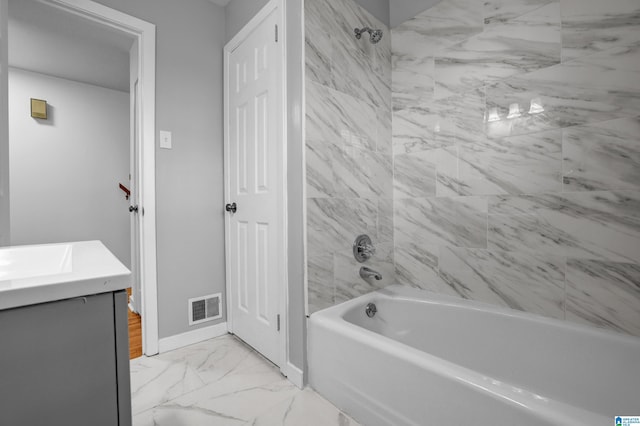 bathroom with marble finish floor, visible vents, shower / bathing tub combination, vanity, and baseboards