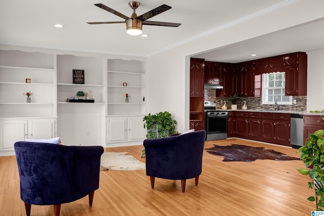 interior space featuring light wood-style flooring, ornamental molding, a ceiling fan, and recessed lighting