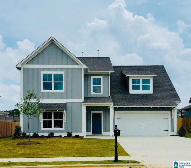 500 Avondale Ln, Pell City, AL 35128 - view of front of house featuring roof with shingles, board and batten siding, concrete driveway, and a garage
