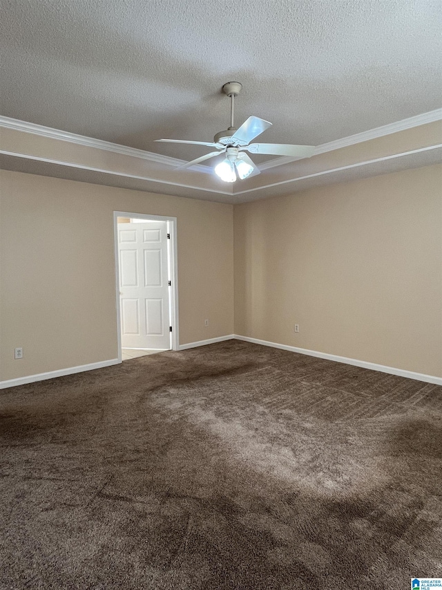 carpeted empty room with ceiling fan and a textured ceiling