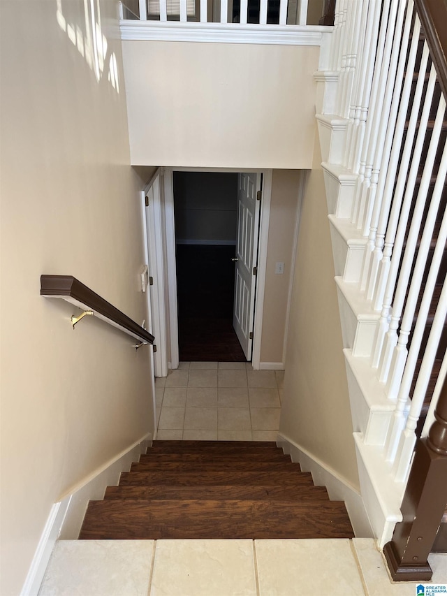 stairs with tile patterned floors