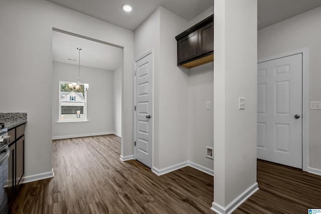 interior space with dark hardwood / wood-style flooring and a chandelier