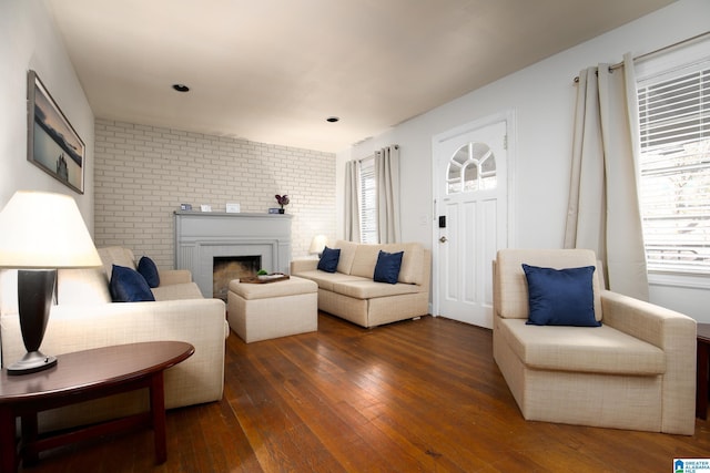 living room with a fireplace and dark hardwood / wood-style floors