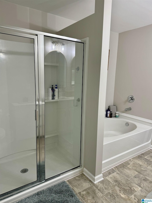 bathroom with separate shower and tub