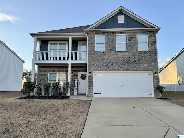 view of front of house with a garage and a balcony