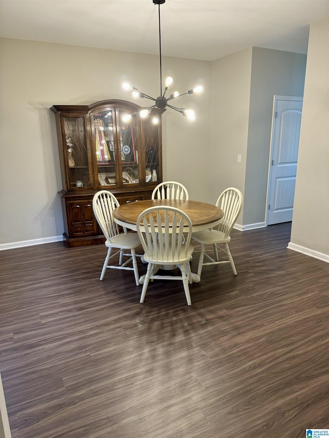 dining room featuring dark wood-type flooring and an inviting chandelier