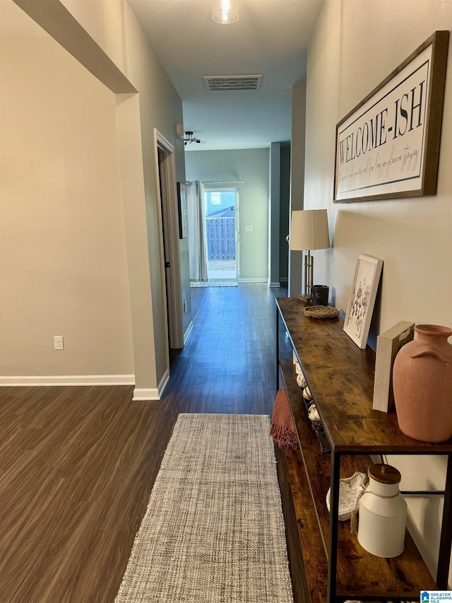 corridor featuring dark hardwood / wood-style floors