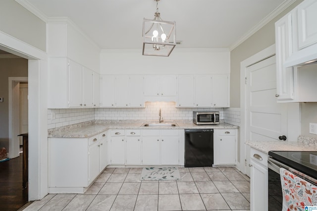 kitchen with white cabinetry, sink, tasteful backsplash, decorative light fixtures, and appliances with stainless steel finishes