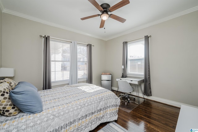 bedroom with ceiling fan, dark wood-type flooring, and ornamental molding