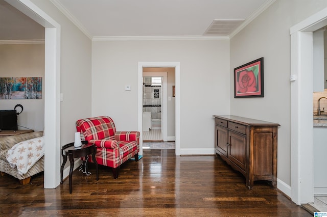 sitting room featuring dark hardwood / wood-style flooring, ornamental molding, and sink