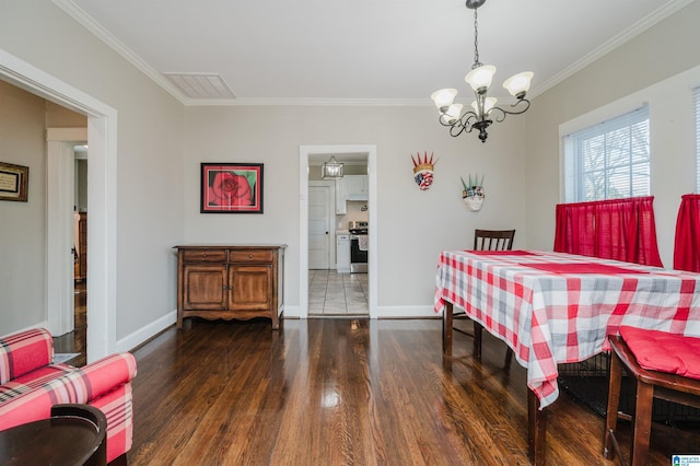 dining space with a notable chandelier, dark hardwood / wood-style flooring, and crown molding