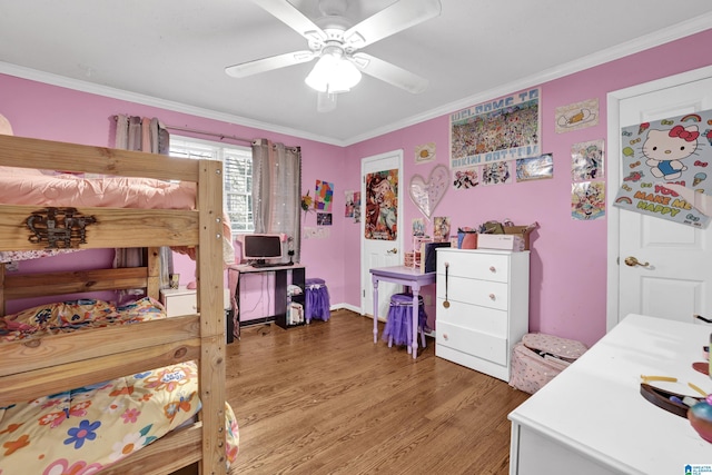 bedroom featuring ceiling fan, crown molding, and wood-type flooring