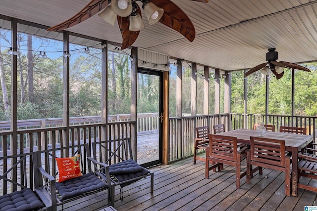 sunroom / solarium featuring ceiling fan and a healthy amount of sunlight